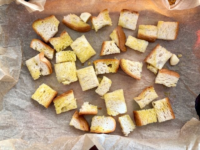 Chunks of bread drizzled with olive oil