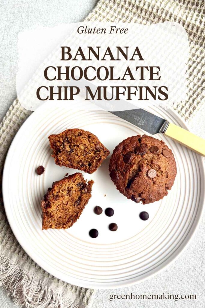 Twp Banana Chocolate Chip Muffins on a plate. One muffin is cut in half with the knife placed on the side of the plate.