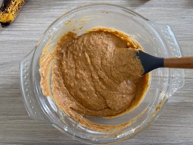 Wet and dry ingredients combined using spatula to make batter