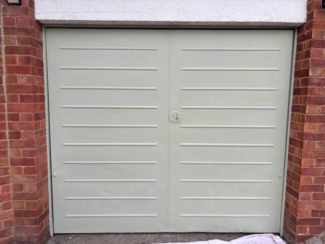 First coat of paint applied to garage door