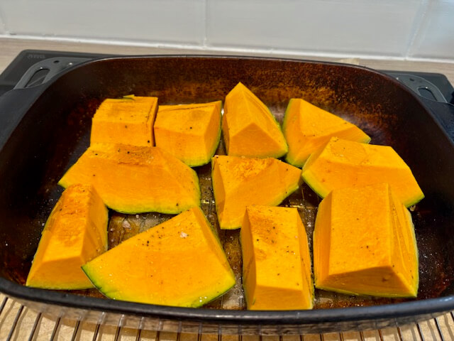 Slices of pumpkin on a baking tray