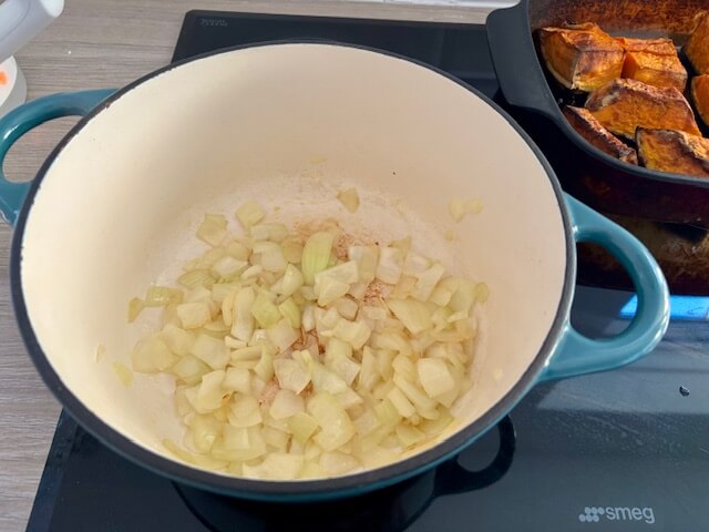 Sliced onions in a Dutch oven