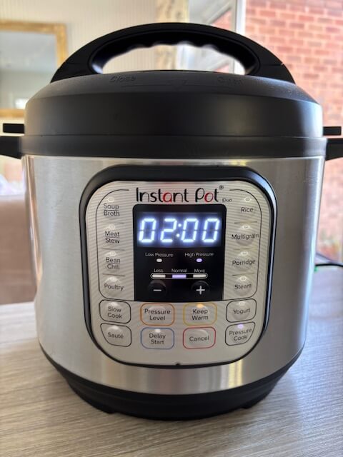 Instant Pot displaying 2 hours on pressure cook setting