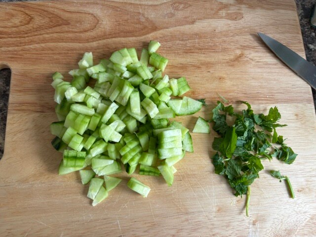 Cucumber and mint on chopping board