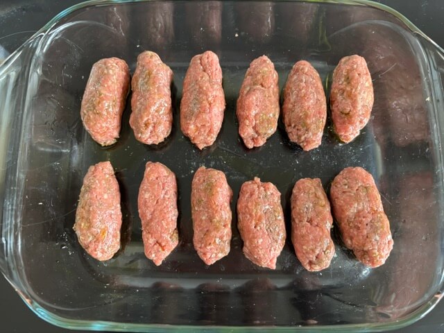 Lamb koftas in dish ready to cook